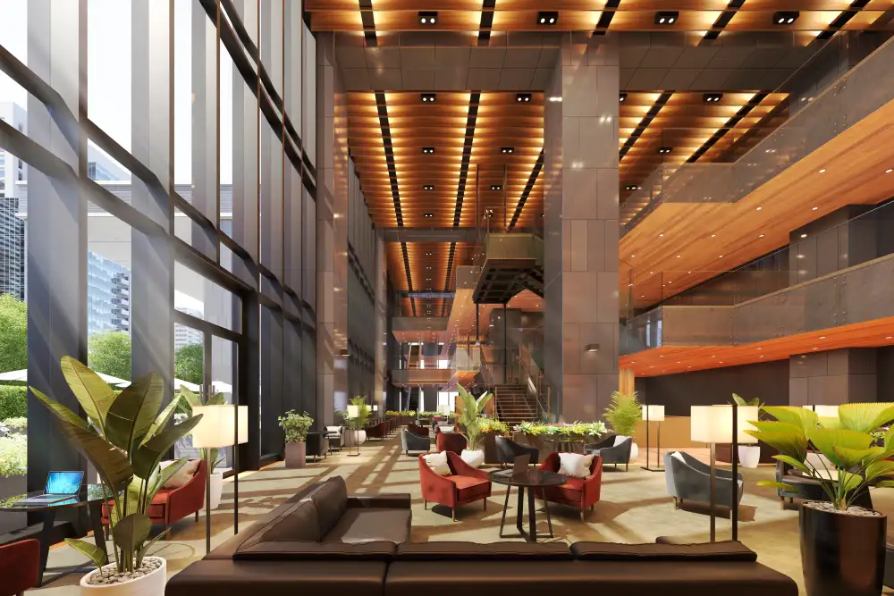 Stilvoll beleuchtete Hotel-Lobby mit luxuriöser Atmosphäre, unterstützt durch ein individuelles Signature-Duftkonzept.